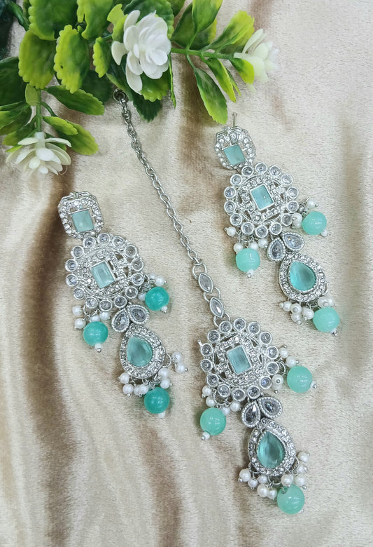 Long earrings and tika