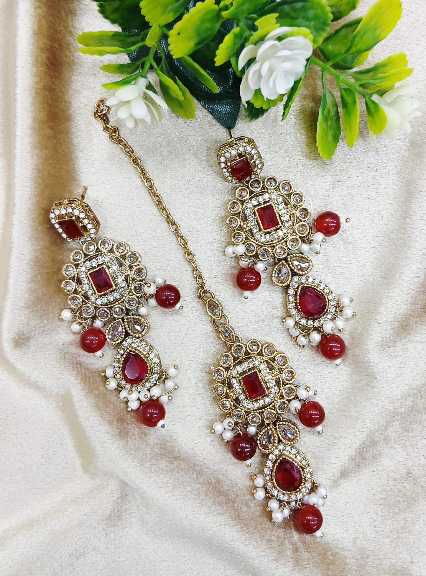Long earrings and tika
