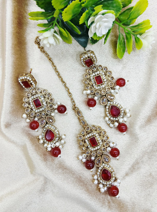 Long earrings and tika