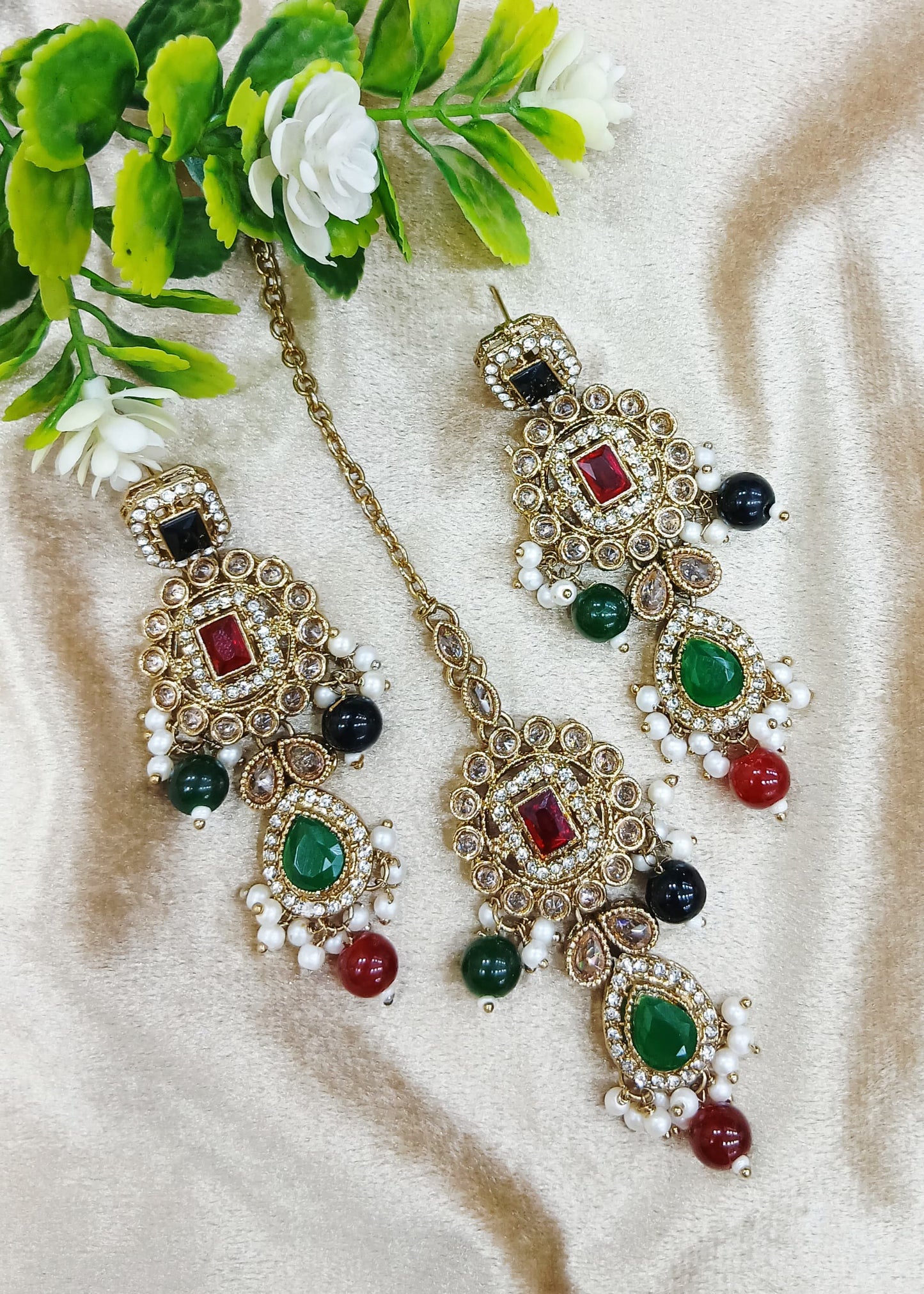 Long earrings and tika