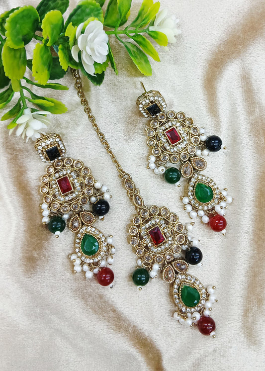 Long earrings and tika