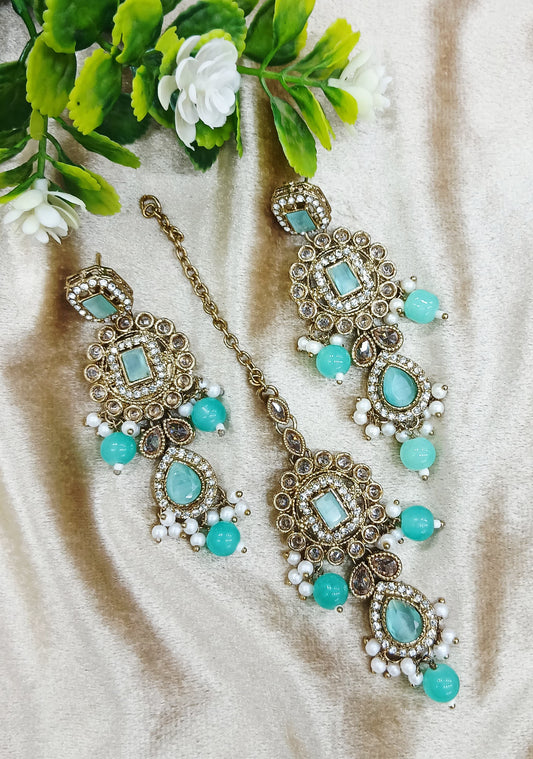 Long earrings and tika