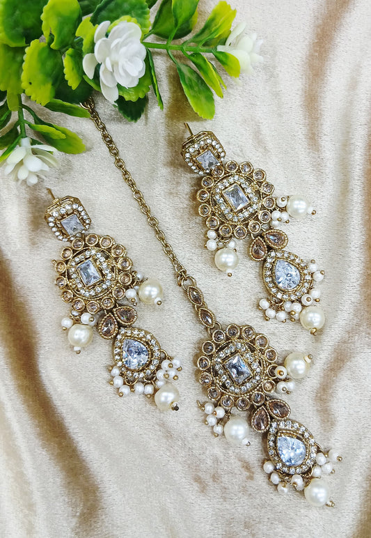 Long earrings and tika