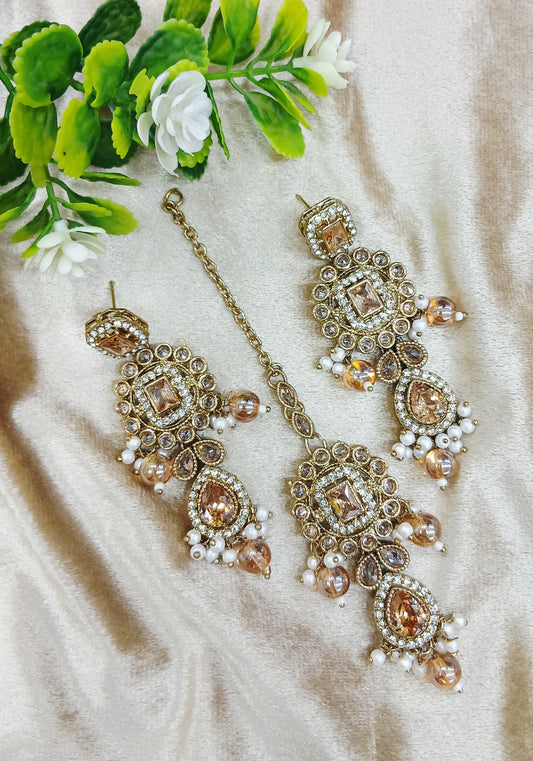 Long earrings and tika