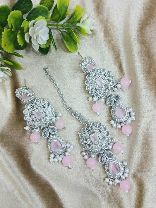 Long earrings and tika